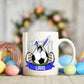 Mug with a soccer ball design featuring bunny ears and the name 'Louis', surrounded by Easter eggs.