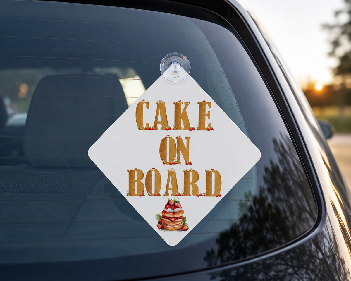 Car sign with 'Cake on Board' text and cake icon on a car window.